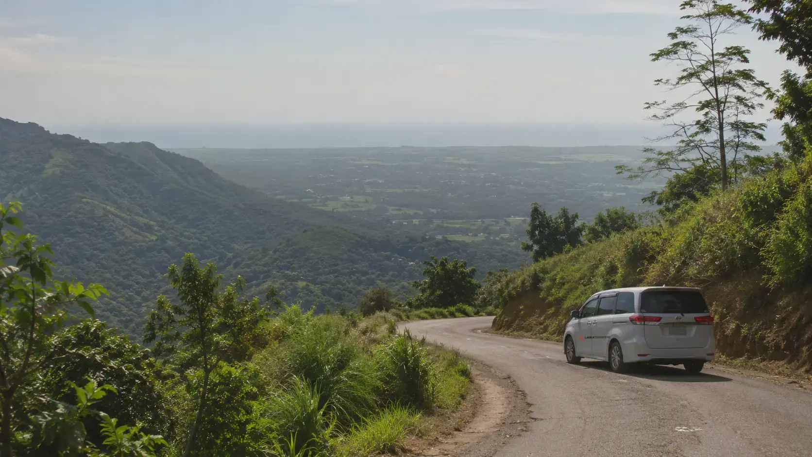 A private vehicle descending from Sri Lanka's hill country toward the south coast